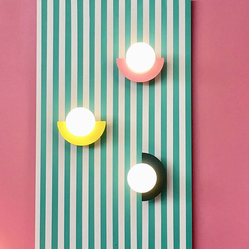 Aurora half moon wall light in a modern living room, coloured glass decorative wall light