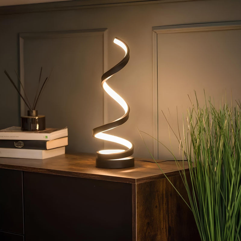 Spiral table lamp full view with spiral metal base and warm glow stylish table lamp