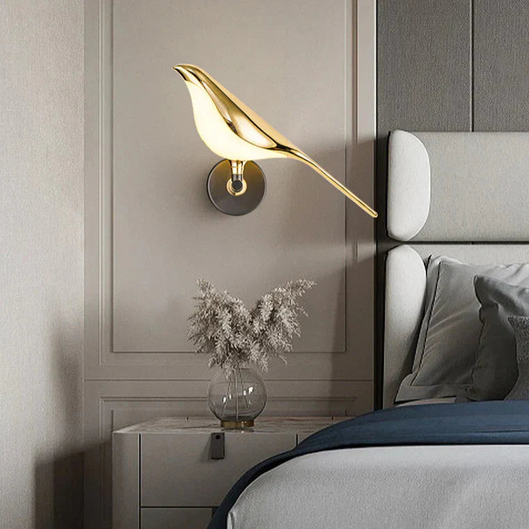 Vogel bird wall light switched on with a warm glow and bird design