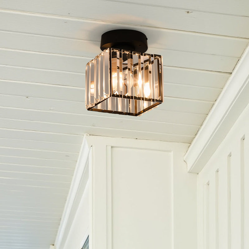 Square Flush Ceiling Light lit from below revealing full light output and gold accent border black square ceiling light