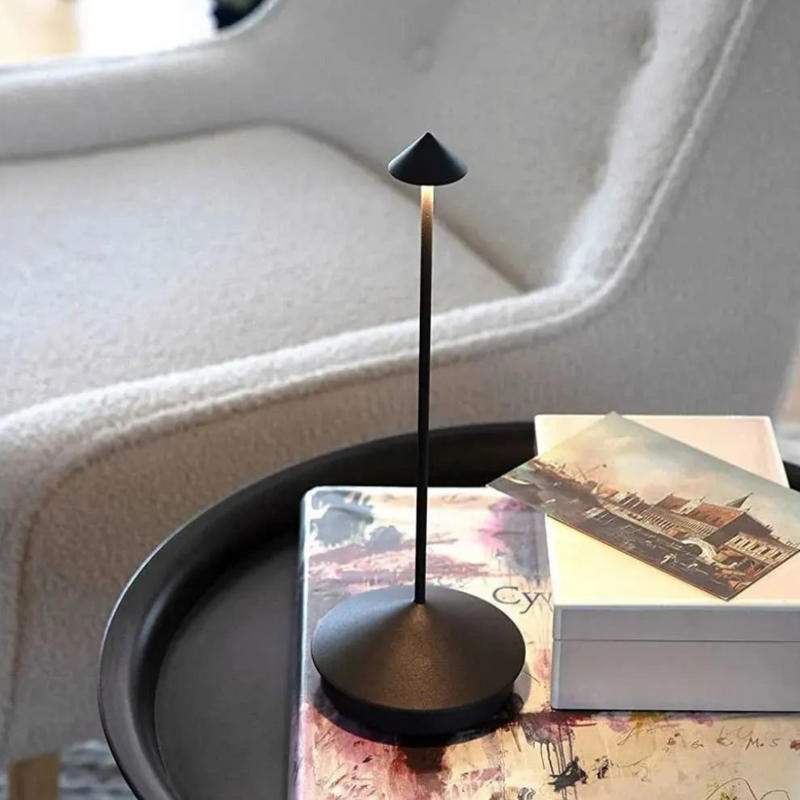 ClarityGlow Table Lamp illuminated in a dimmed setting highlighting warm ambient glow aesthetic desk lamp