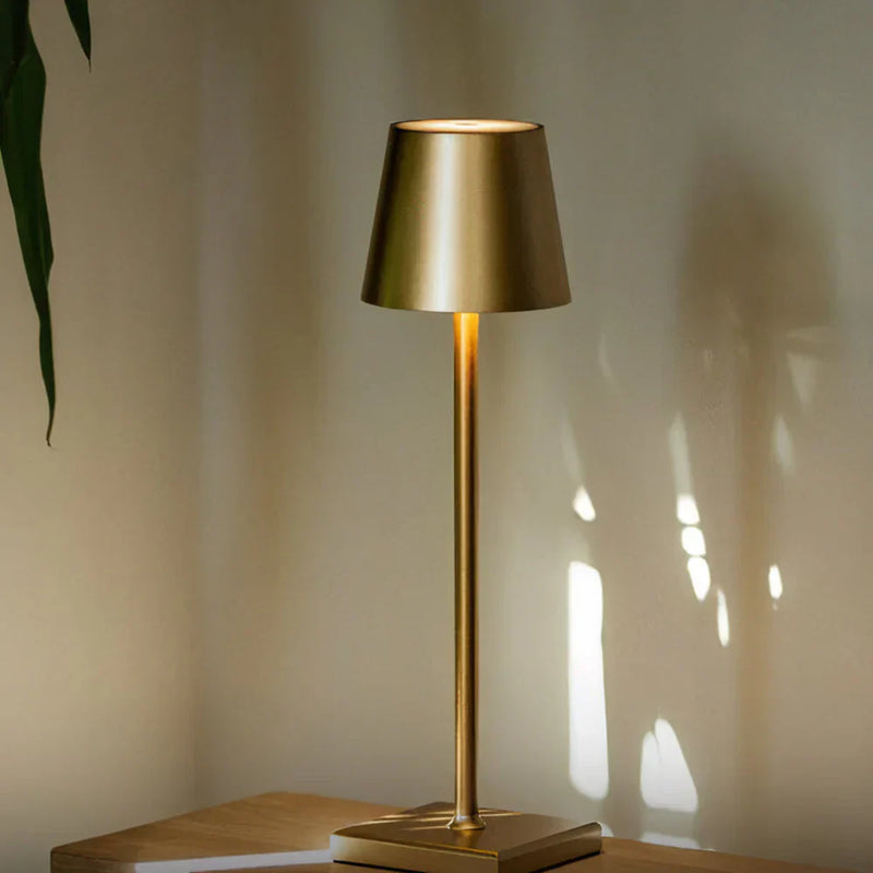 AuraLite Dimmable Touch Table Lamp casting warm ambient light on a bedside table, scandinavian style desk lamp