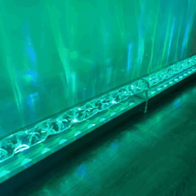 Ocean Wave projector animated moving wave light effect on a wall in action, ocean light effect