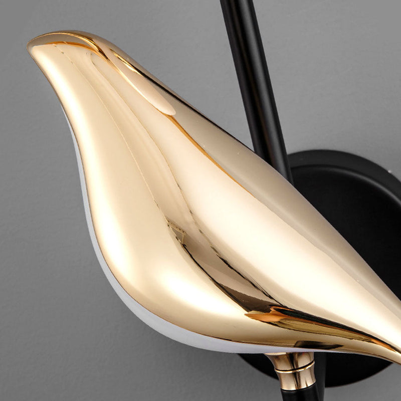 Vogel bird wall light with a stylised bird and atmospheric lighting