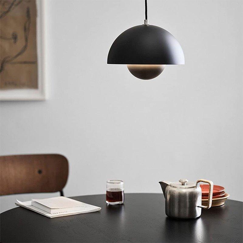 Nordlicht planter pendant light decorated with a green plant, Nordic interior design