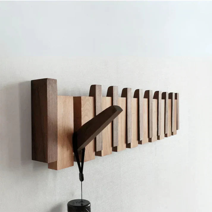 Piano solid wood coat rack mounted on a wall
