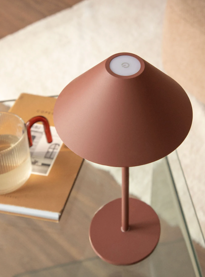 Cordless touch table lamp in atmospheric evening lighting for outdoor areas