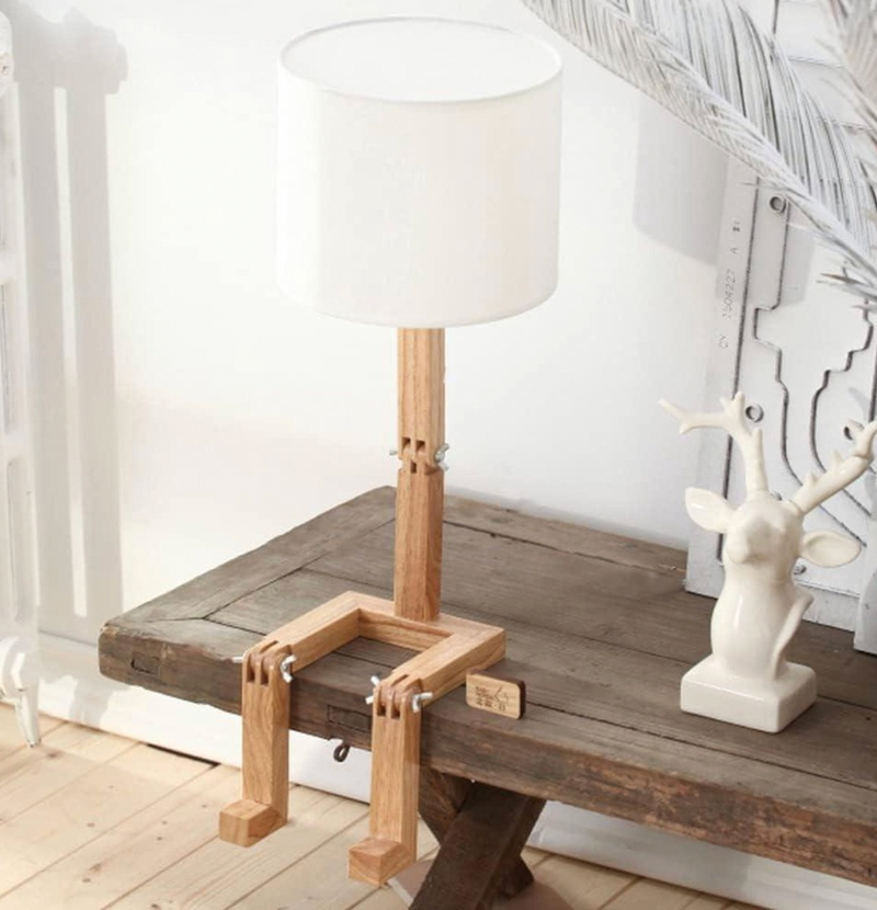 White table lamp with wooden shelf dimmable, close-up of the switch and material