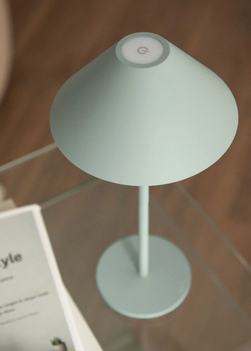 Cordless touch table lamp on a set table as a decorative home accent