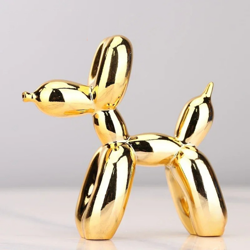 Gold balloon dog sculpture in resin