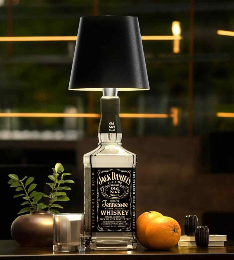 GlowBottle in black on a Jack Daniel's bottle, outdoor evening mood bottle lamp