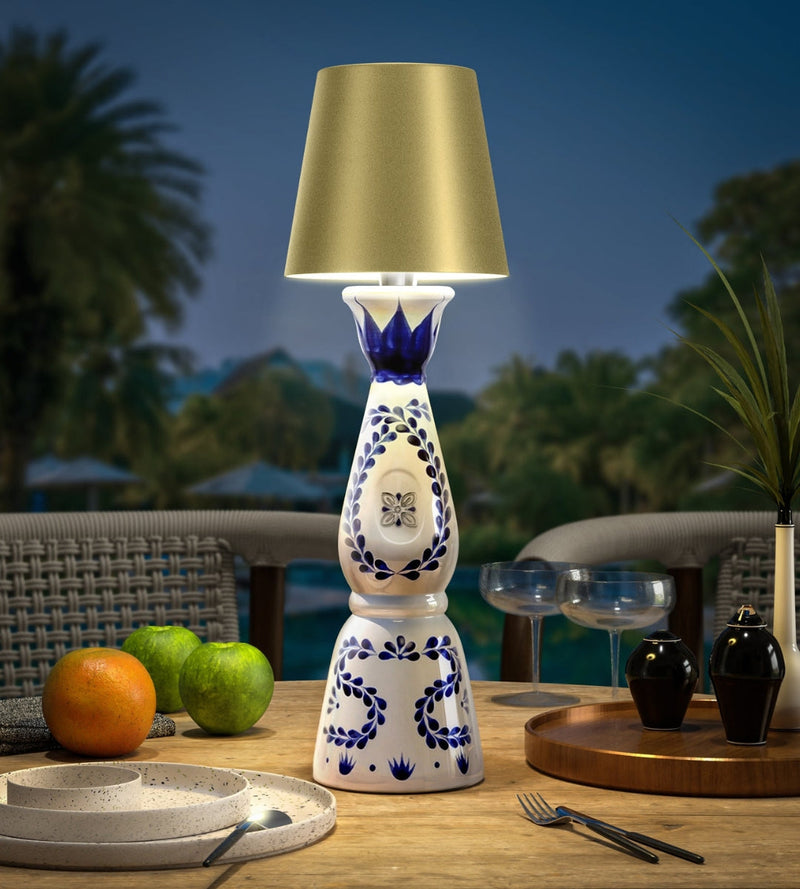 GlowBottle matte gold on a Clase Azul bottle, outdoor mood light