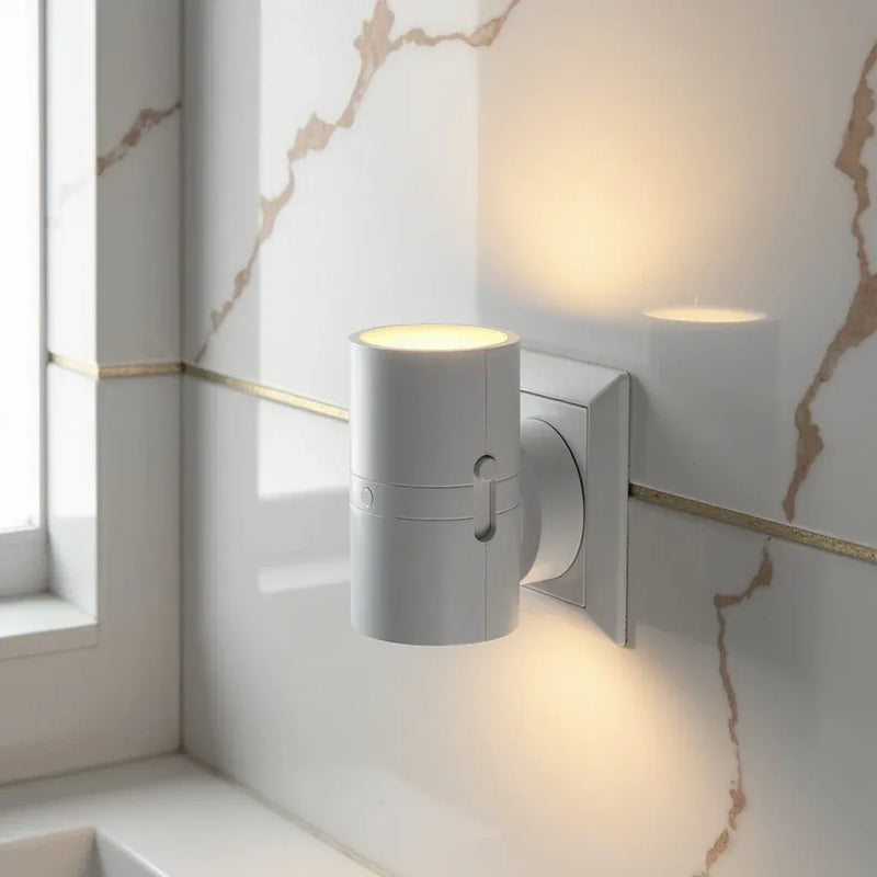 NightLuxe Wall Light white finish close-up product shot minimalist wall sconce UK bedroom setting