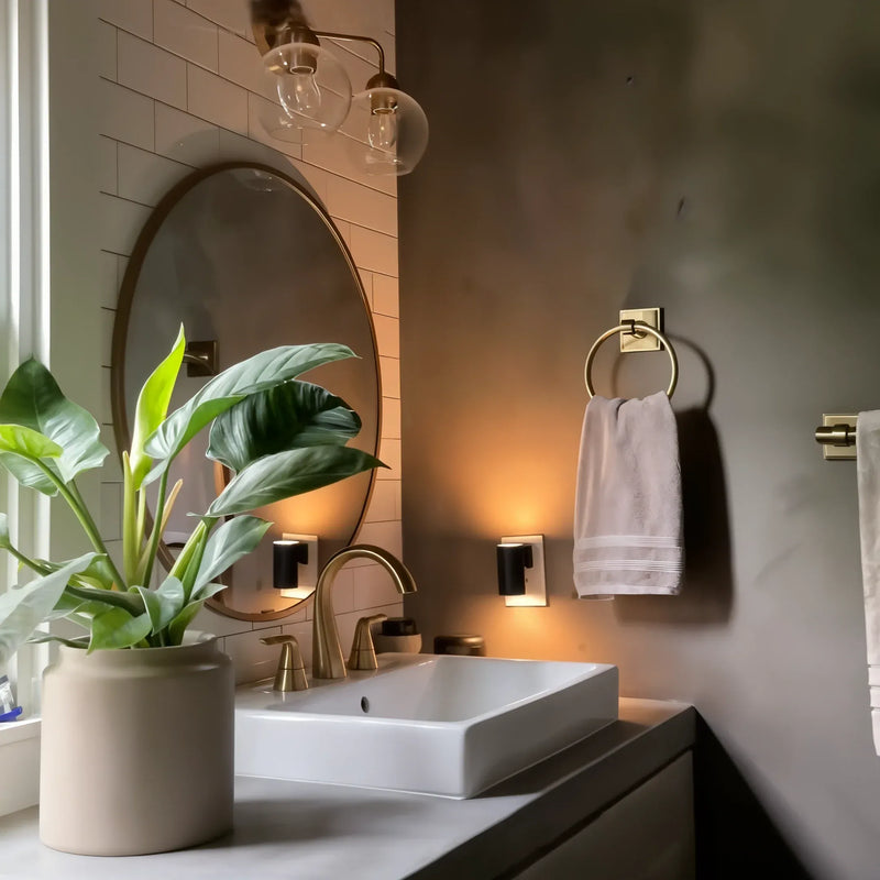 NightLuxe Wall Light installed in upscale bathroom showing Bauhaus wall lamp ambient glow above mirror