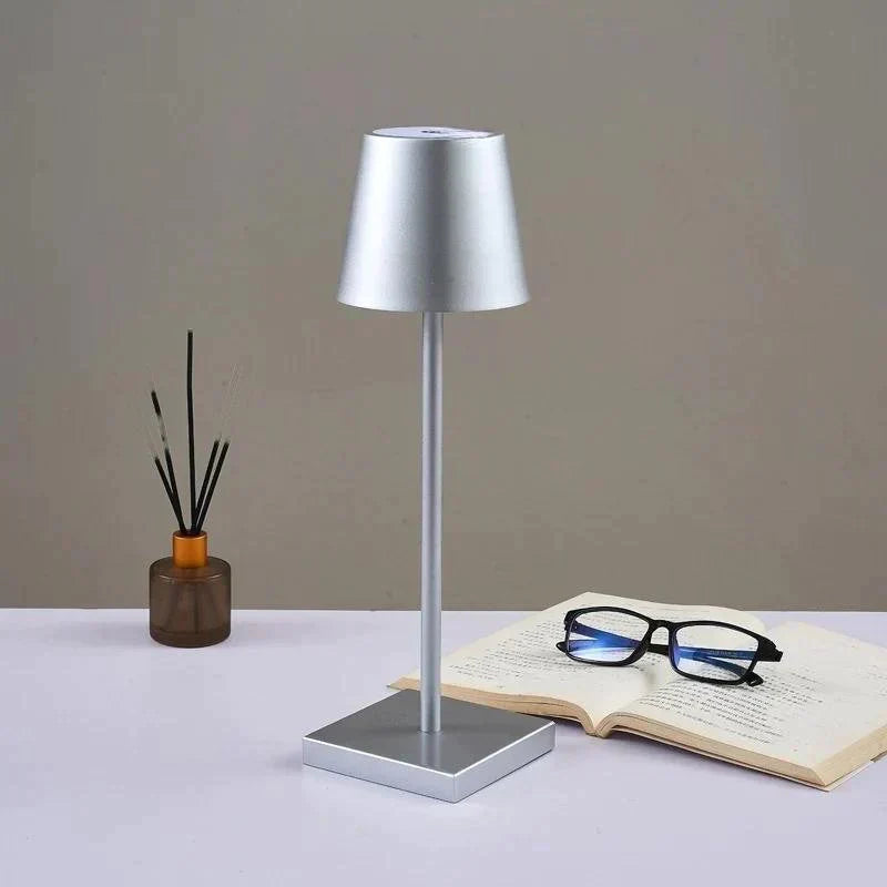AuraLite Modern Table Lamp | Cordless Rechargeable Dimmable Touch Light switched on with a warm glow scandinavian style desk lamp