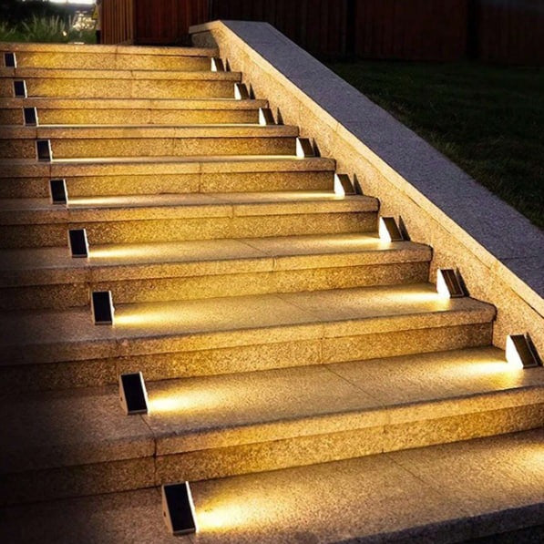 EcoGlow Outdoor Solar Path Lights set into garden pathway emitting warm white LED glow at dusk solar powered garden lights