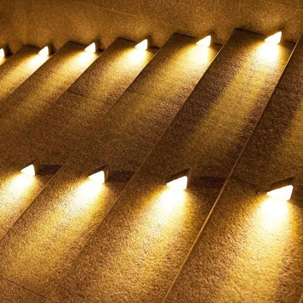 EcoGlow Outdoor Solar Path Lights lined along a gravel garden path glowing softly at twilight solar garden pathway lights