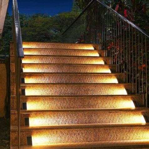 EcoGlow Outdoor Solar Path Lights flush-mounted in ground along decorative garden border solar garden pathway lights
