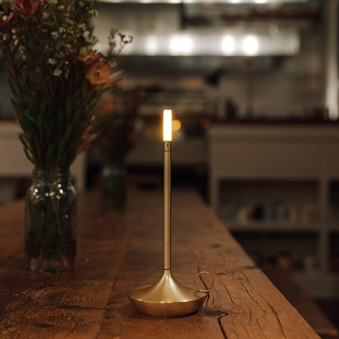 Scandinavian Kandelaar lamp lifestyle shot, dimmable cordless table lamp in a cosy home setting