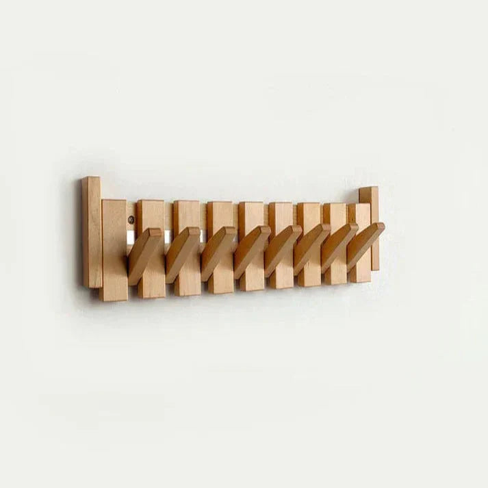 Piano wooden wall coat rack in beech mounted on a wall