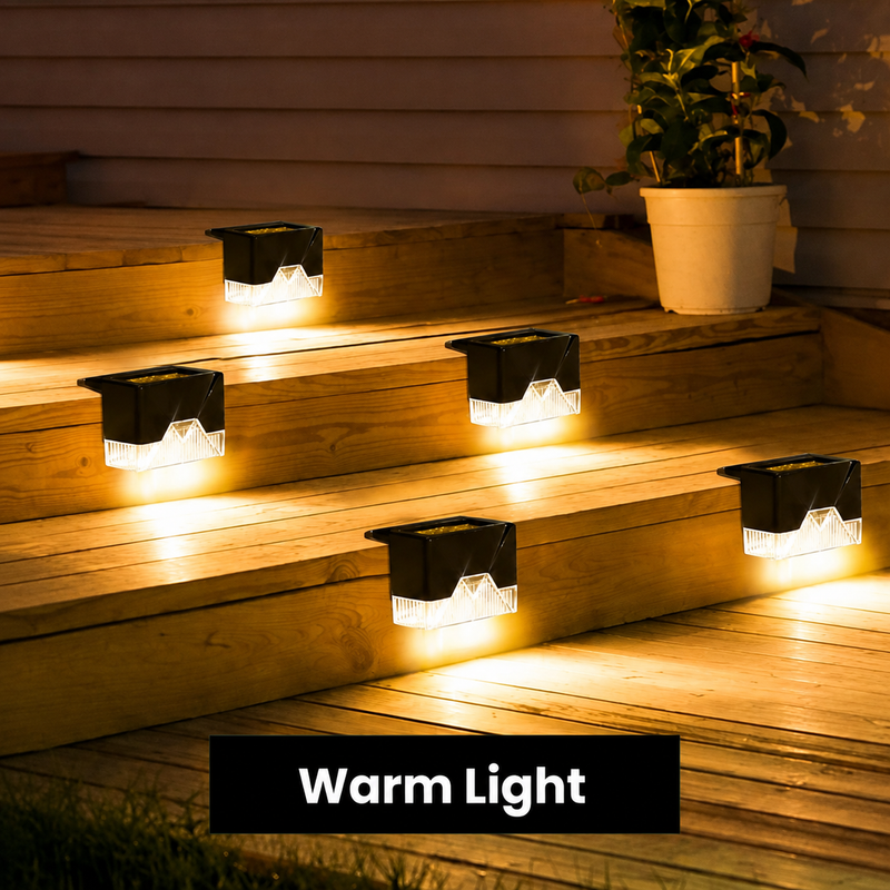 Solar outdoor lights on wooden decking steps at night, warm light setting